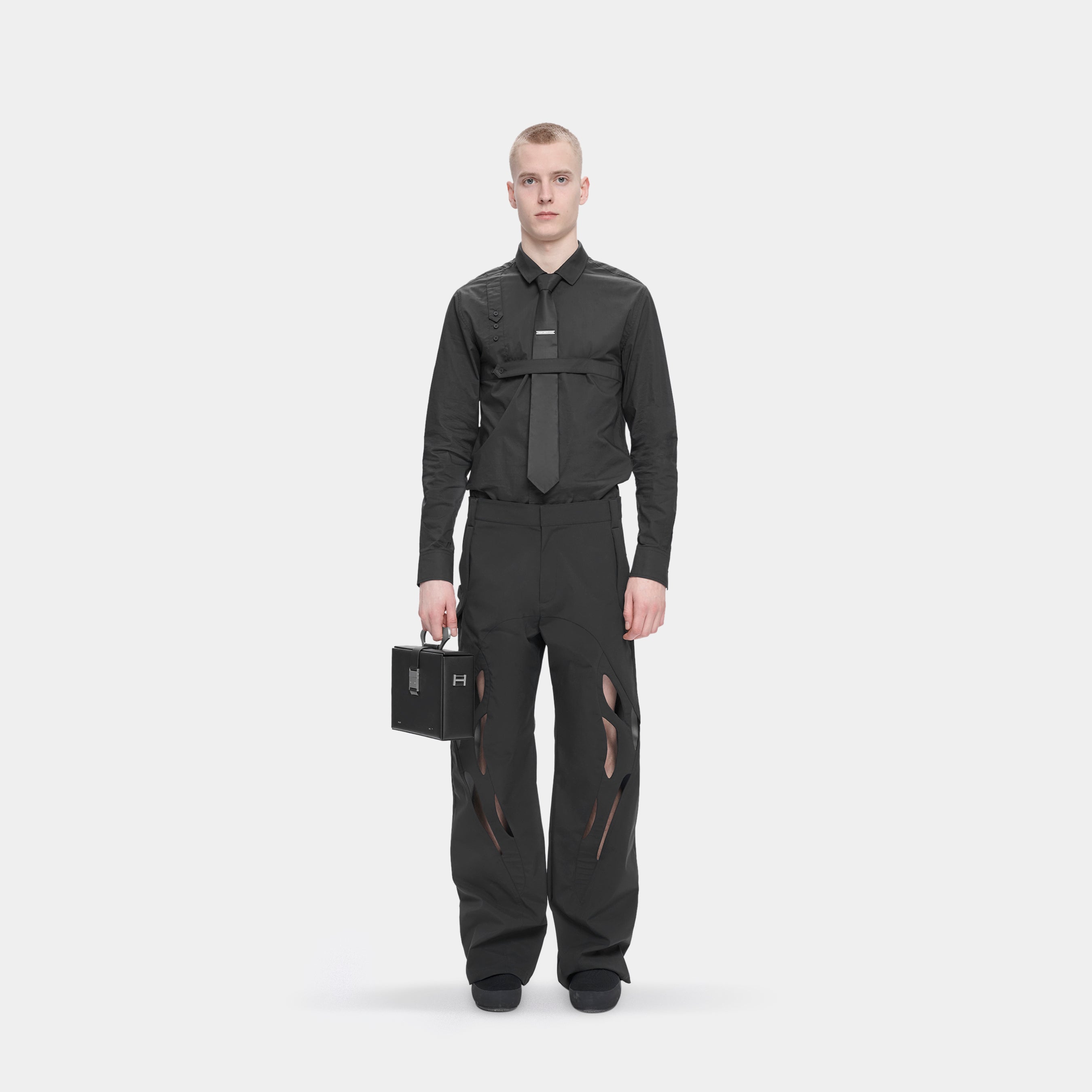 HE, product: TACK TROUSERS (Fig. 2)