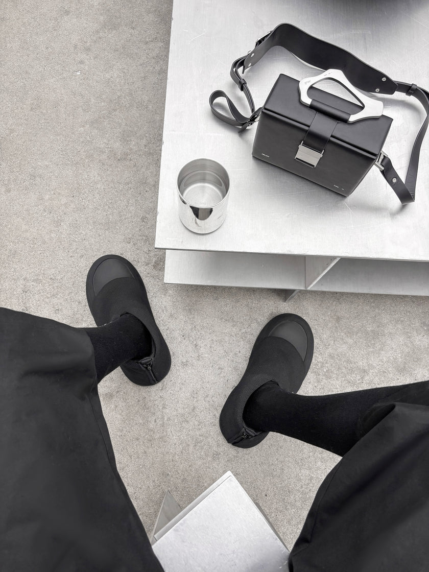 HE, product: ORMA BOOTS (Fig. 12)