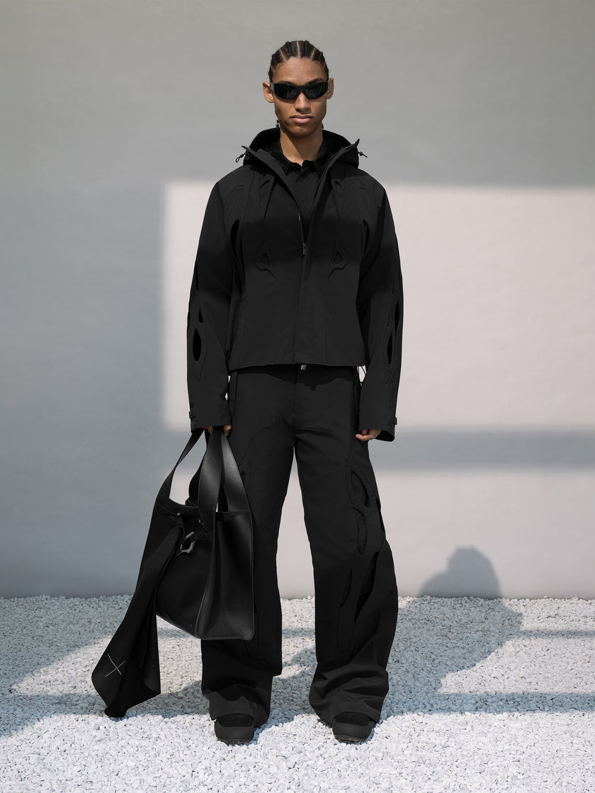 HE, product: TACK TROUSERS (Fig. 9)